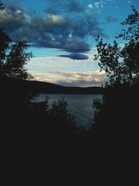 Scenic view of lake against sky at sunset