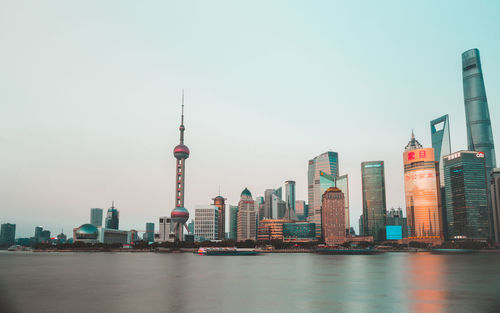 Modern buildings in city against sky