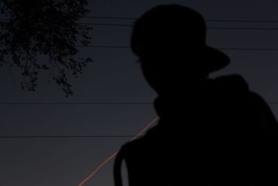 Silhouette man standing against clear sky