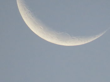 Low angle view of moon in sky at night
