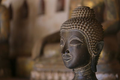 Close-up of buddha statue in temple