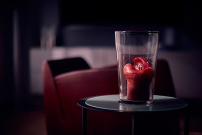 Close-up of red wine in glass on table