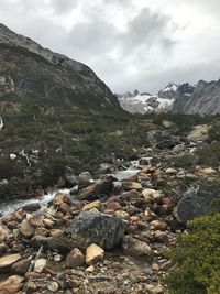 Scenic view of rocks and mountains against sky