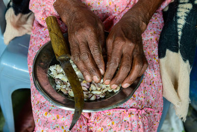 Midsection of woman holding food