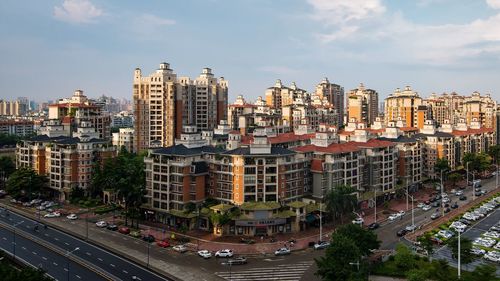 High angle view of buildings in city against sky