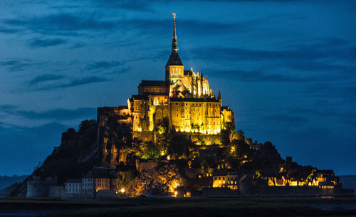 Illuminated cathedral against sky at night