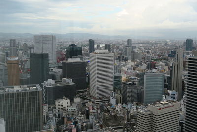 High angle view of modern buildings in city against sky