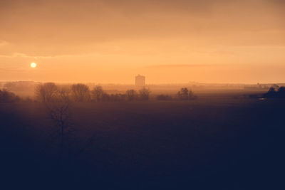 Scenic view of landscape at sunset