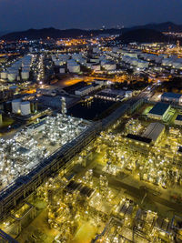 High angle view of illuminated buildings in city at night