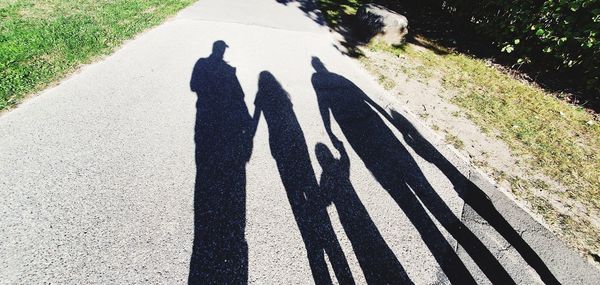 High angle view of shadow of person on road