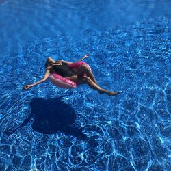 Woman swimming in pool