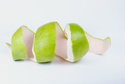 Close-up of fruits against white background