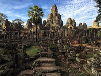 Old ruins of temple against cloudy sky