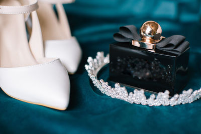 Bridal accessories. bridal shoes, perfume and crown.