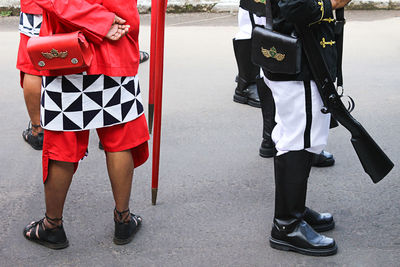 Low section of military people standing on road