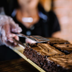 Midsection of woman having food