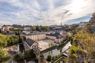 High angle view of buildings and trees against sky