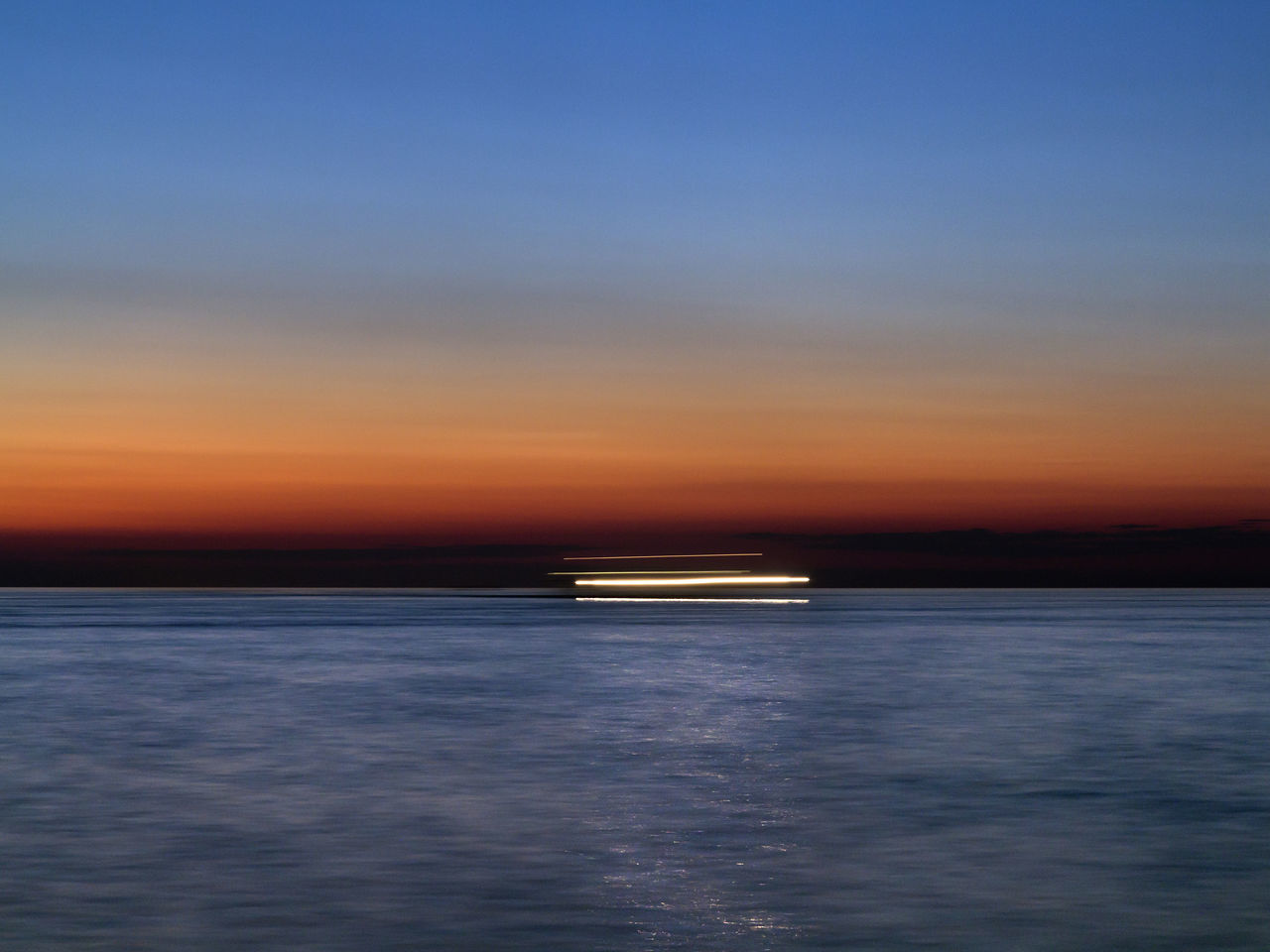 sea, sky, sunset, water, nautical vessel, scenics - nature, beauty in nature, waterfront, transportation, orange color, mode of transportation, no people, nature, tranquility, tranquil scene, cloud - sky, motion, ship, horizon, outdoors, horizon over water, passenger craft, cruise ship