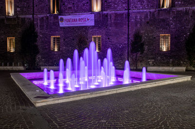 Panoramic view of illuminated building at night