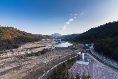 High angle view of road by river against sky