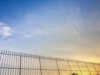 Low angle view of bridge against sky during sunset