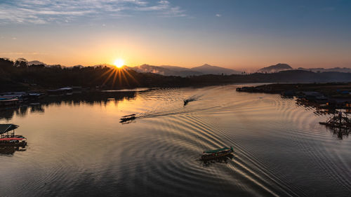 Scenic view of lake against sky during sunset