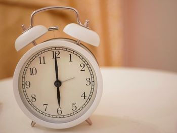 Close-up of clock on table