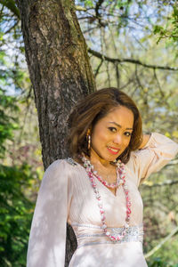 Portrait of a smiling young woman in park