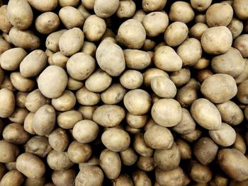 Full frame shot of raw potatoes for sale at market stall