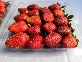 High angle view of strawberries on table