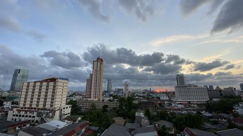 Modern buildings in city against sky