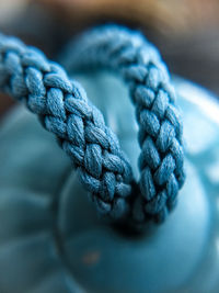 Close-up of rope tied on table