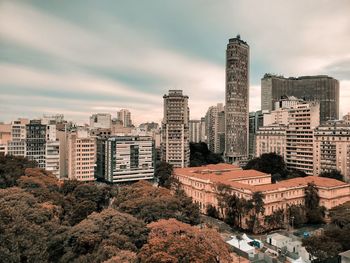 High angle view of buildings in city against sky