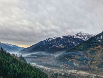 Scenic view of mountains against sky during winter