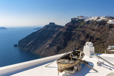 Scenic view of sea and mountains against sky