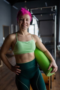 Young woman exercising in gym