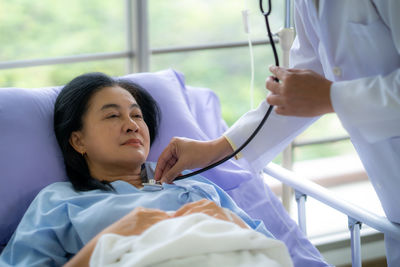Young woman sleeping on bed