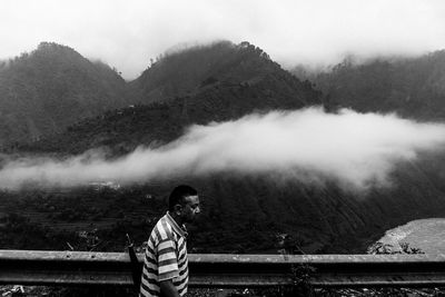 Scenic view of mountains in foggy weather