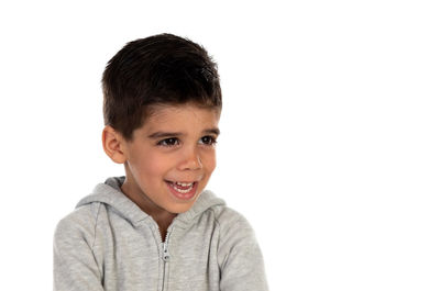 Portrait of happy boy against white background