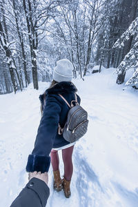 Full length of woman on snow covered land