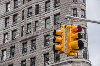 Low angle view of yellow building against sky
