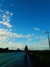 People on road against sky