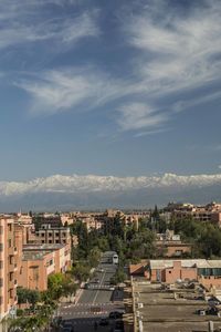 High angle view of buildings in city against sky