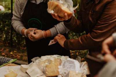 Midsection of woman holding ice cream