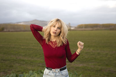 Young woman standing on field