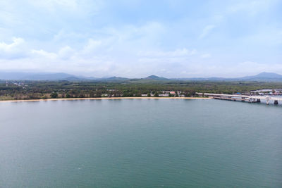 Scenic view of sea against sky in city