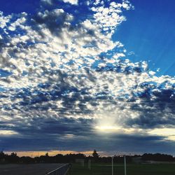 Scenic view of landscape against cloudy sky