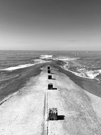 Scenic view of sea with pier against clear sky