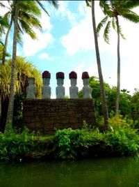 View of palm trees against sky