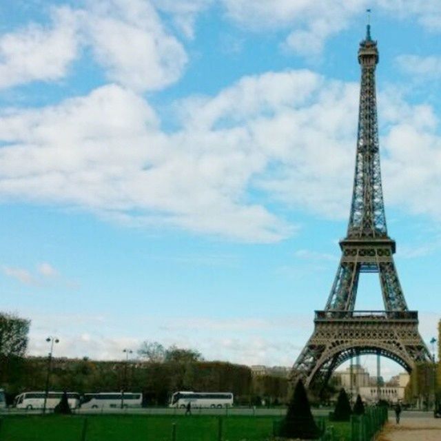 architecture, built structure, famous place, international landmark, building exterior, travel destinations, capital cities, tourism, tower, eiffel tower, travel, sky, city, tall - high, history, culture, cloud - sky, low angle view, monument, incidental people